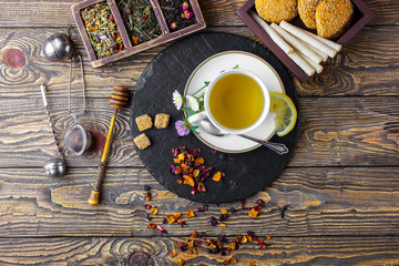 Tea on an old background, in a composition with accessories on the table