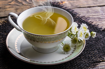 Tea in a cup on an old background