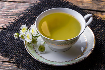 Tea on an old background, in a composition with accessories on the table