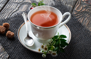 Tea in a cup on an old background