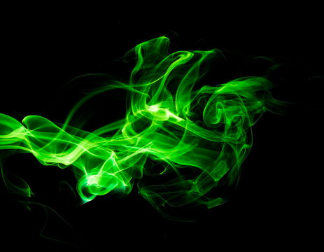 Green smoke on black background