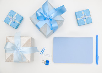 Notebook and gift box on white background