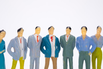 Group of figure miniature businessman or small people investor and office worker secretary on white background for money and financial business teamwork concept.