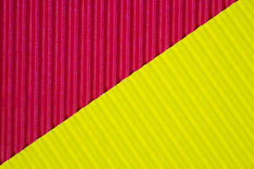 Red and yellow corrugated paper texture, use for background. vivid colour with empty space for add text or object.