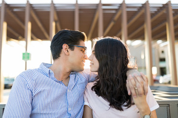 Cute Couple Holding Hands About To Kiss On Date