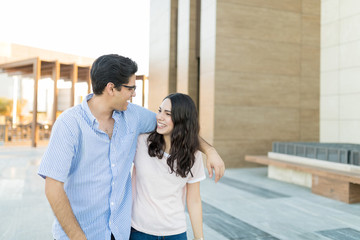 Lovers Strolling While Hanging Out On Weekend