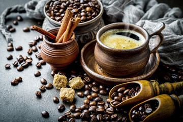 Black coffee in a cup on old background