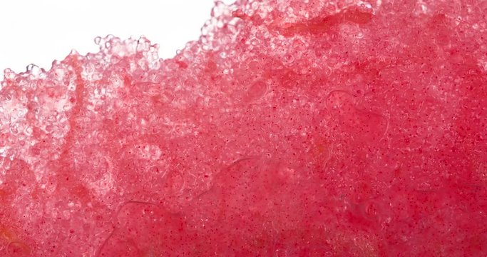 Squeeze Juicy Watermelon Slice. Slices and slices of watermelon are compressed and crushed close-up on a bright white background, creating a juicy splash of pulp and juice. Shooting at 120 fps