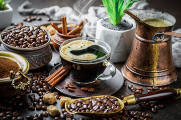 Fototapeta na wymiar Black coffee in a cup on old background