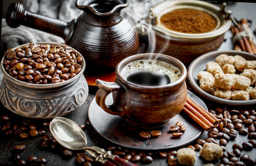 Black coffee in a cup on old background