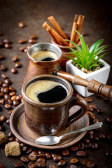 Black coffee in a composition with kitchen accessories