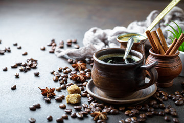 Black coffee in a cup on old background