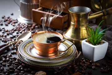 Black coffee in a composition with kitchen accessories