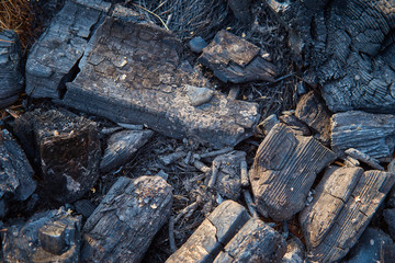 Fototapeta na wymiar Burning charcoal firewood in the fireplace or the stove.