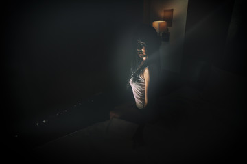 double exposure of ghost woman in haunted hotel with dark filter, halloween concept