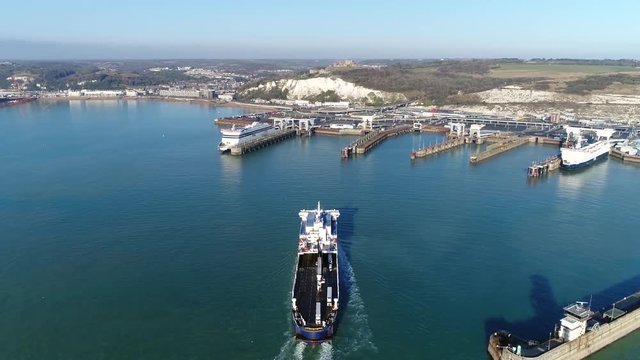 Aerial footage of ferry arriving in Dover a major port in Kent South East England the harbor provides much of the towns employment, as does tourism visits for the white cliffs 4k high resolution
