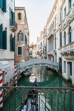 Italy, Venice, Canal with bridge and houses