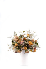 dried flowers in white vase