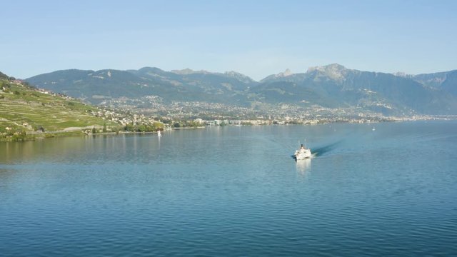 Flying in reverse over Lake L&radic;&copy;man with Belle-Epoque steam boat, Vevey, Montreux and the Alps in the background - Switzerland