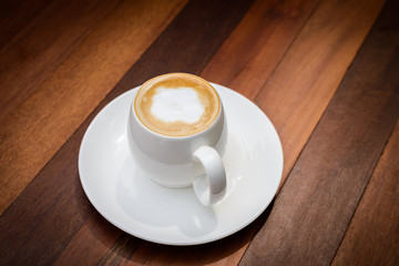Cup of coffee hot latte on wood table