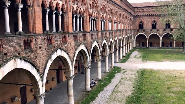 Medieval courtyard at Visconti Castle or Castello Visconteo in Pavia, Italy