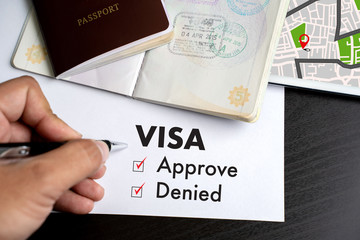 Visa and passport to approved stamped on a document top view in Immigration Visa approve