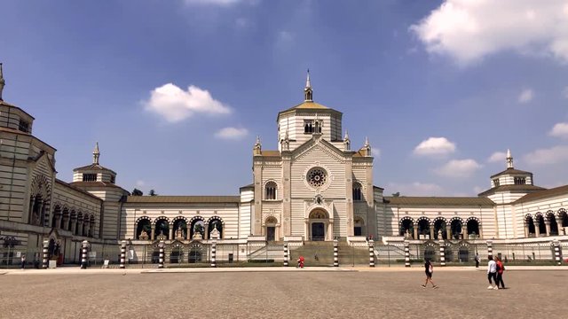 People visiting Monumental Cemetery designed by Carlo Maciachini in Milan, Italy