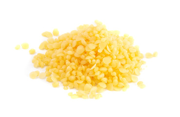 Pile of Natural Yellow Beeswax Pearls on a Wax Background - obrazy, fototapety, plakaty