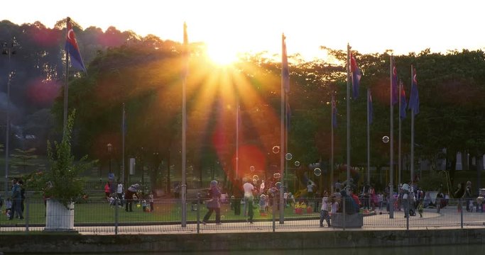 Taman Merdeka in the evening with sun rays shining behind the trees