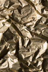 Golden crumpled material background