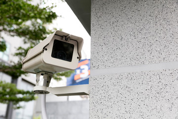 Outdoor security camera in front of condominium