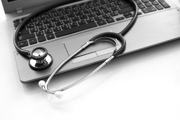 Computer laptop electronic device fix. Stethoscope on Notebook. It support concept.