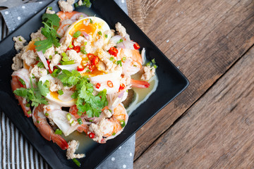 Close up of  Thai Local food, Spicy Green Eggplant Salad with Prawns