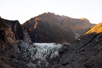 The Glacier among the mountain. Morning light. Fox Glacier, New Zealand.