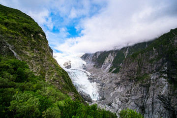 Fototapeta na wymiar Fraz josef Glacier among the mountain view form Roberts Point Track. West coast, New Zealand.