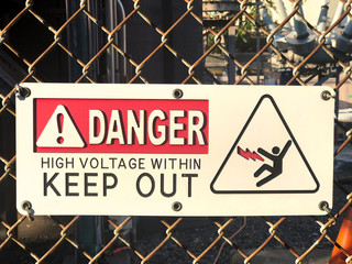 High Voltage sign on a fence