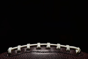 American football on a black background