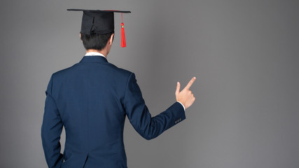 business man is holding graduation hat, business education concept