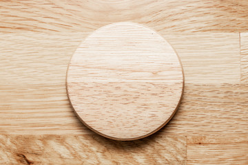 Empty wooden plate with the soft wood background.