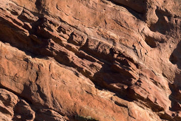 Red rock wind worn texture at sunrise