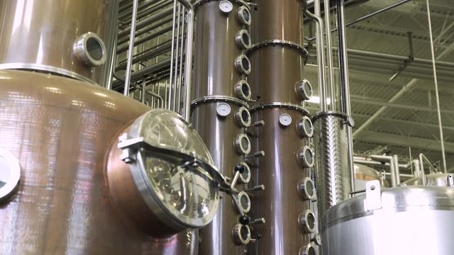 Whisky distiller in large brewery and distillery