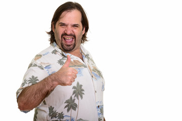 Happy fat Caucasian man smiling giving thumb up ready for vacati