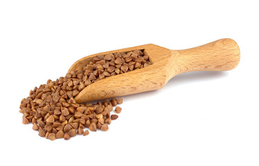 Buckwheat on wooden scoop isolated on white background