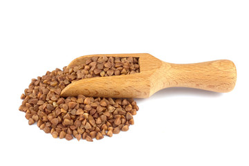 Buckwheat on wooden scoop isolated on white background