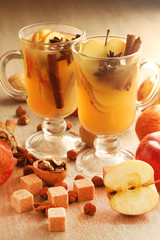 Two cups with hot cider in cold season with cinnamon and anise