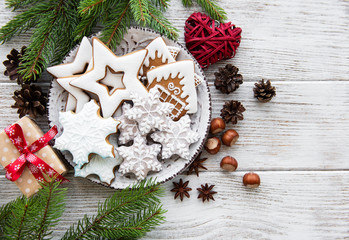 Christmas cookies and Christmas tree on a old wooden table