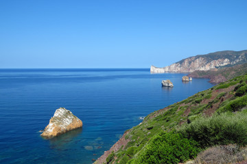 Scenic panoramic view of the coast line and Mediterranean Sea at southwest Sardinia, Italy