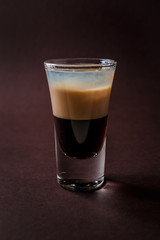 B-52 alcoholic shot glass on elegant dark brown background