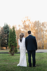 the groom and the bride hold hands, wedding day