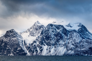 Beautiful winter landscape with mountains and sea
